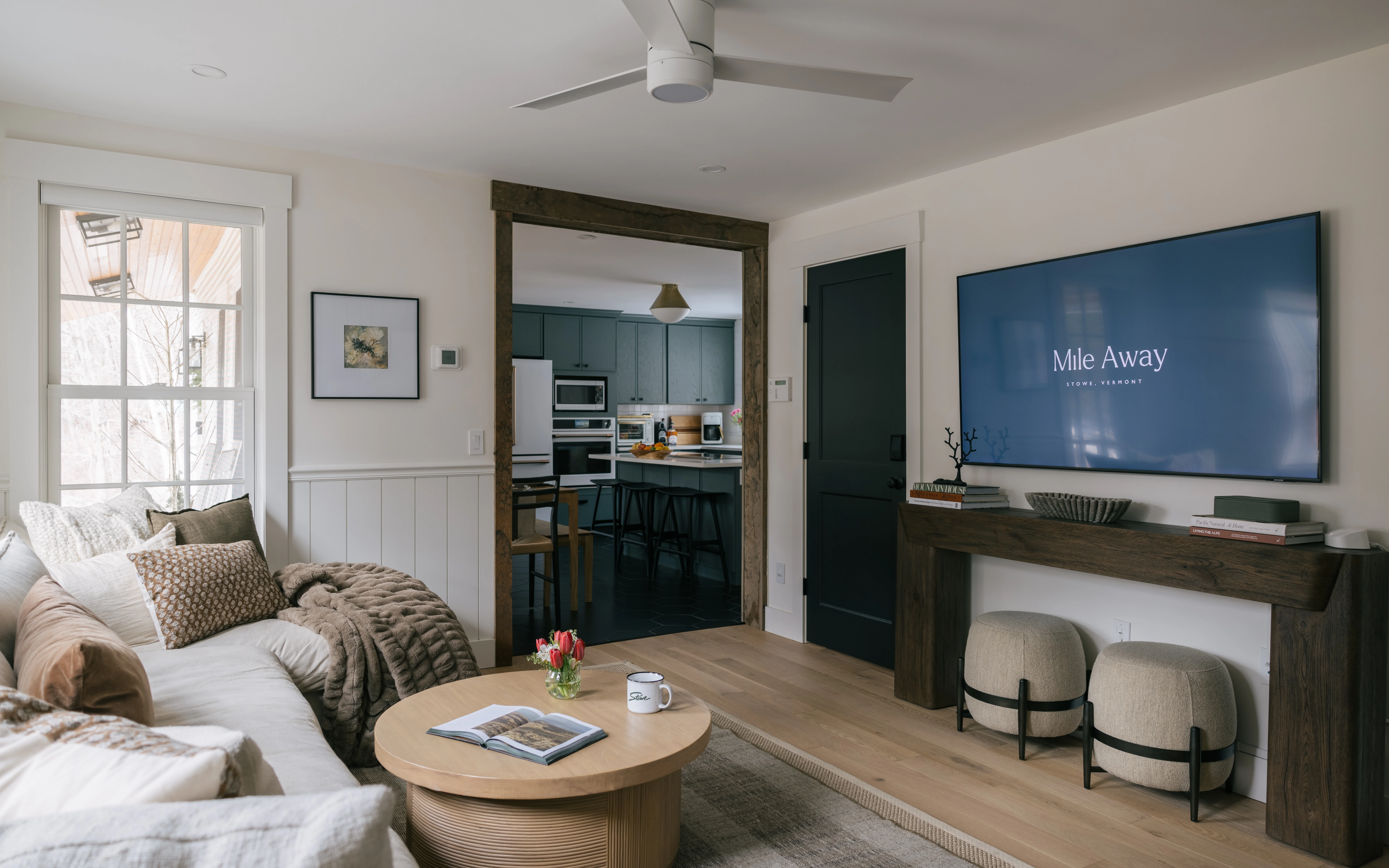 Living room with updated styling and natural light flowing through the main space